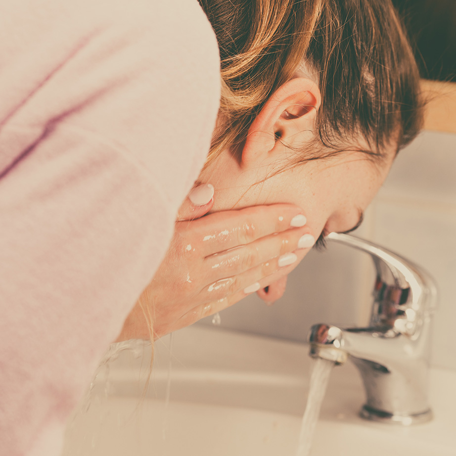 woman washing face